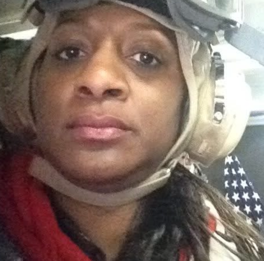 Judge Sheva Sims wearing a military flight helmet and gear