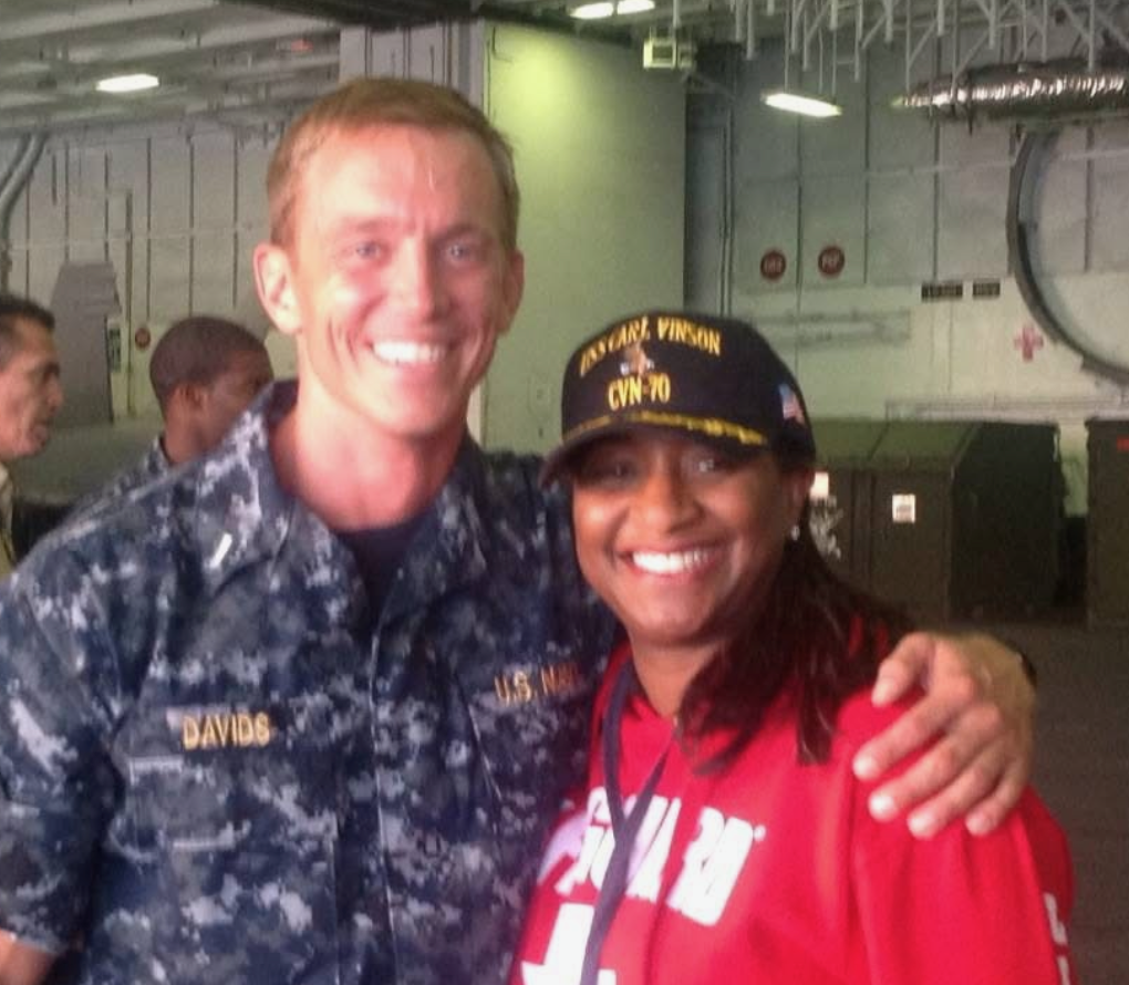 Judge Sheva Sims alongside a U.S. Navy sailor aboard the USS Carl Vinson aircraft carrier